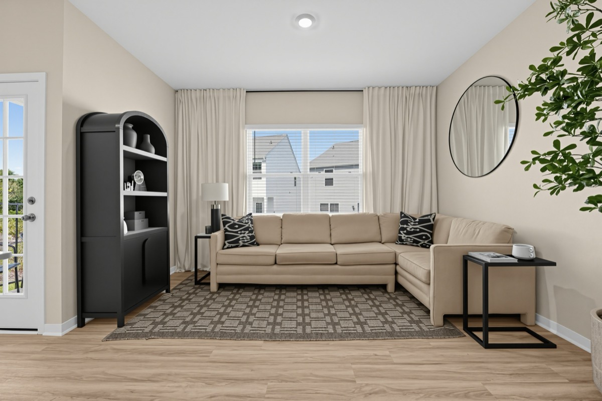 Hubbard living room with a sectional sofa and large window